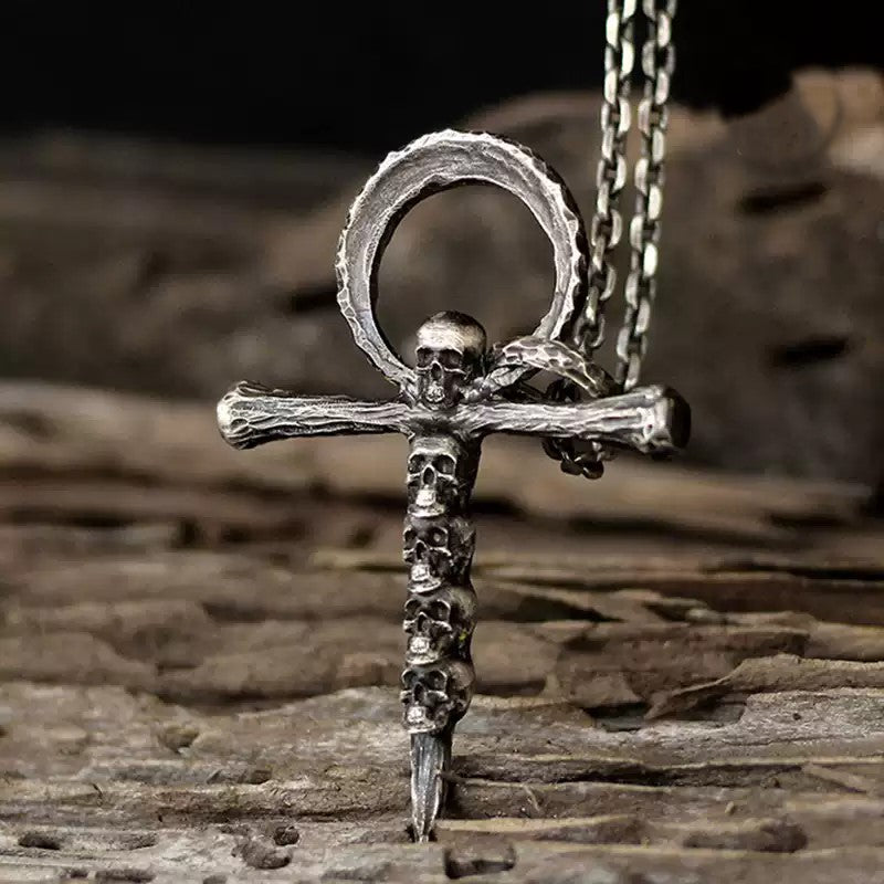 Multi-skull cross necklace
