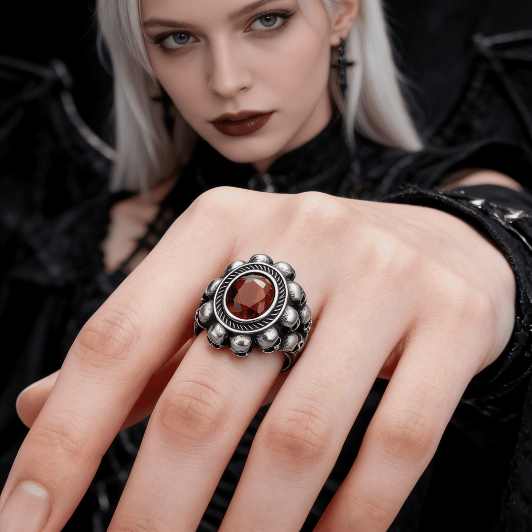 Red round gemstone skull ring