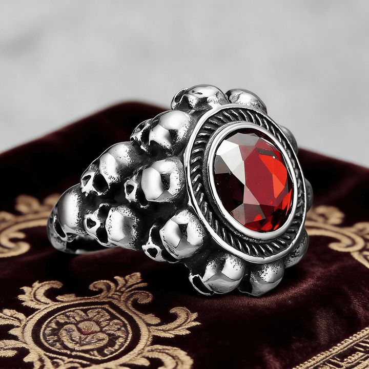 Red round gemstone skull ring