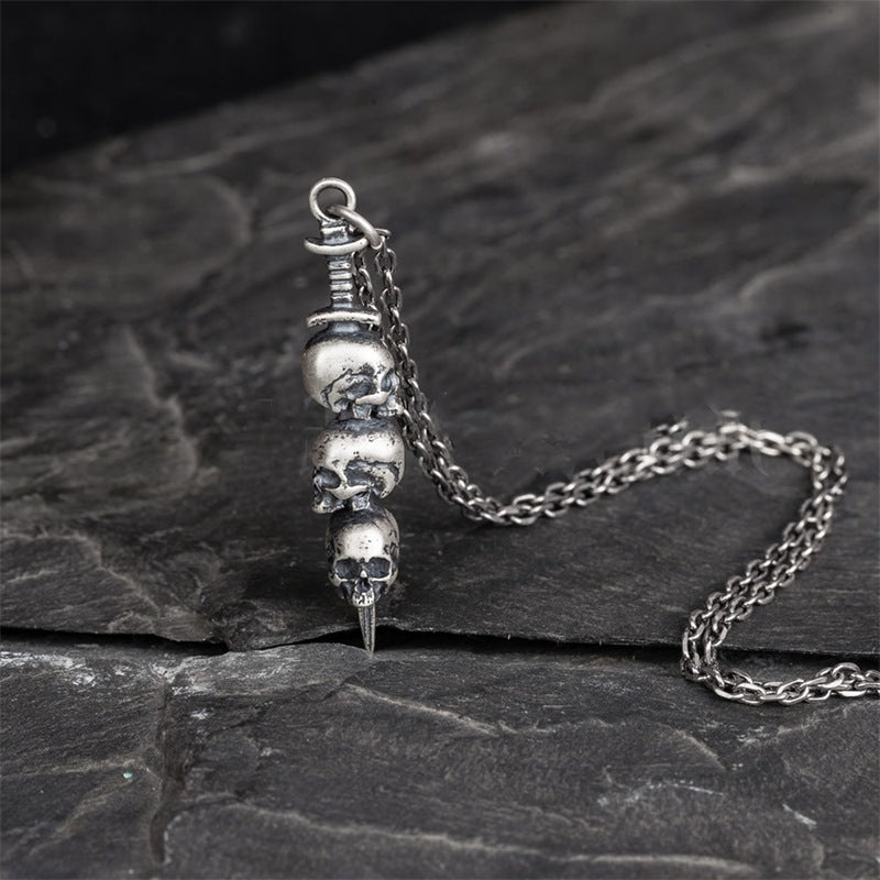 Sword through skull pendant