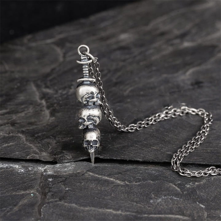 Sword through skull pendant