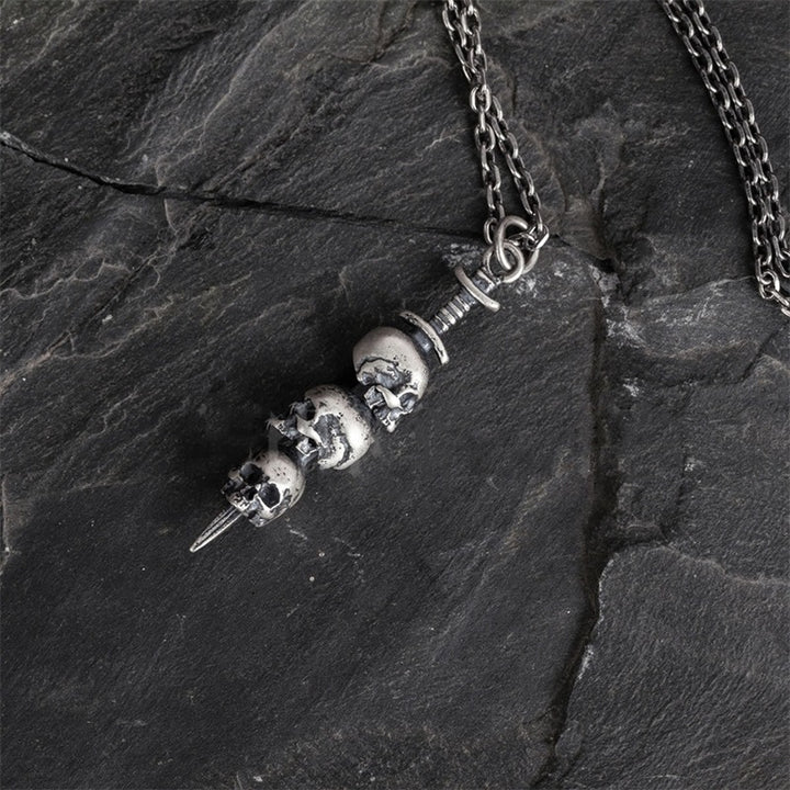Sword through skull pendant