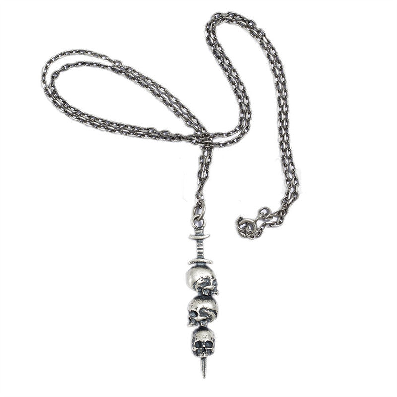 Sword through skull pendant
