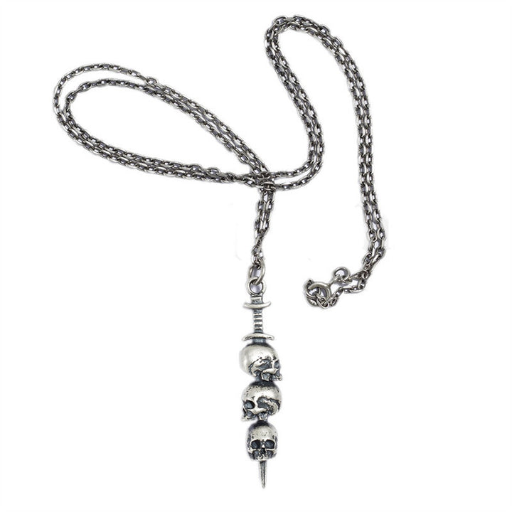 Sword through skull pendant