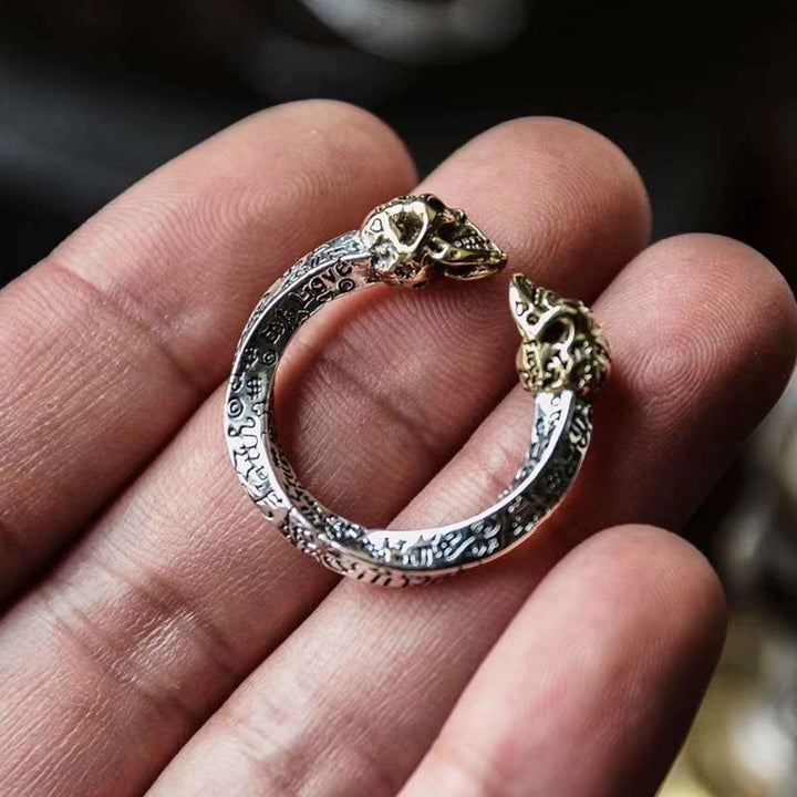 Double skull spiral ring