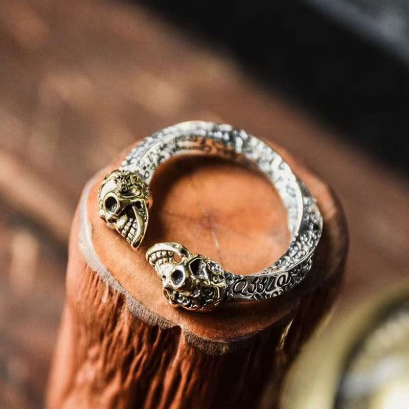 Double skull spiral ring